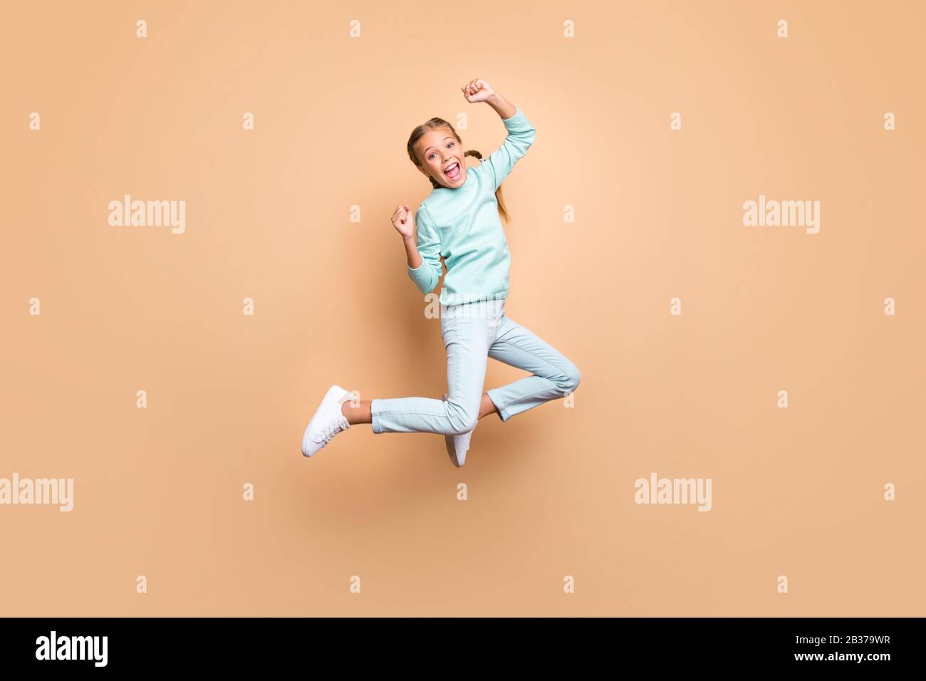 Full Length Body Size Side Profile Photo Jumping High Beautiful She Her  Lady Hands Arms Up Win Game Play Match Wearing Casual Jeans Denim White  Tshirt Clothes Isolated Yellow Bright Vivid Background