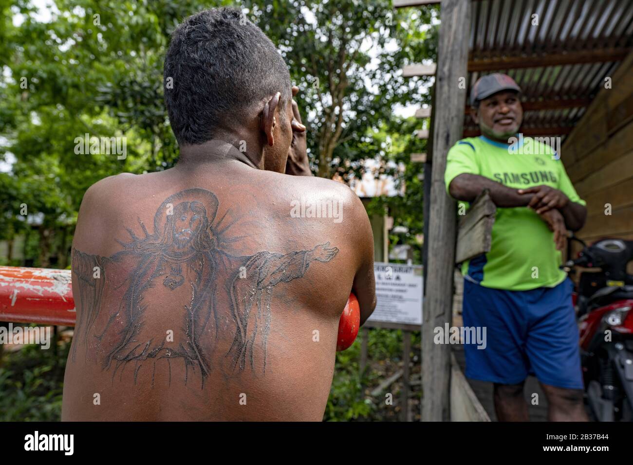 Indonesia, Papua, Asmat district, Agats, Jesus Christ tattoo Stock Photo