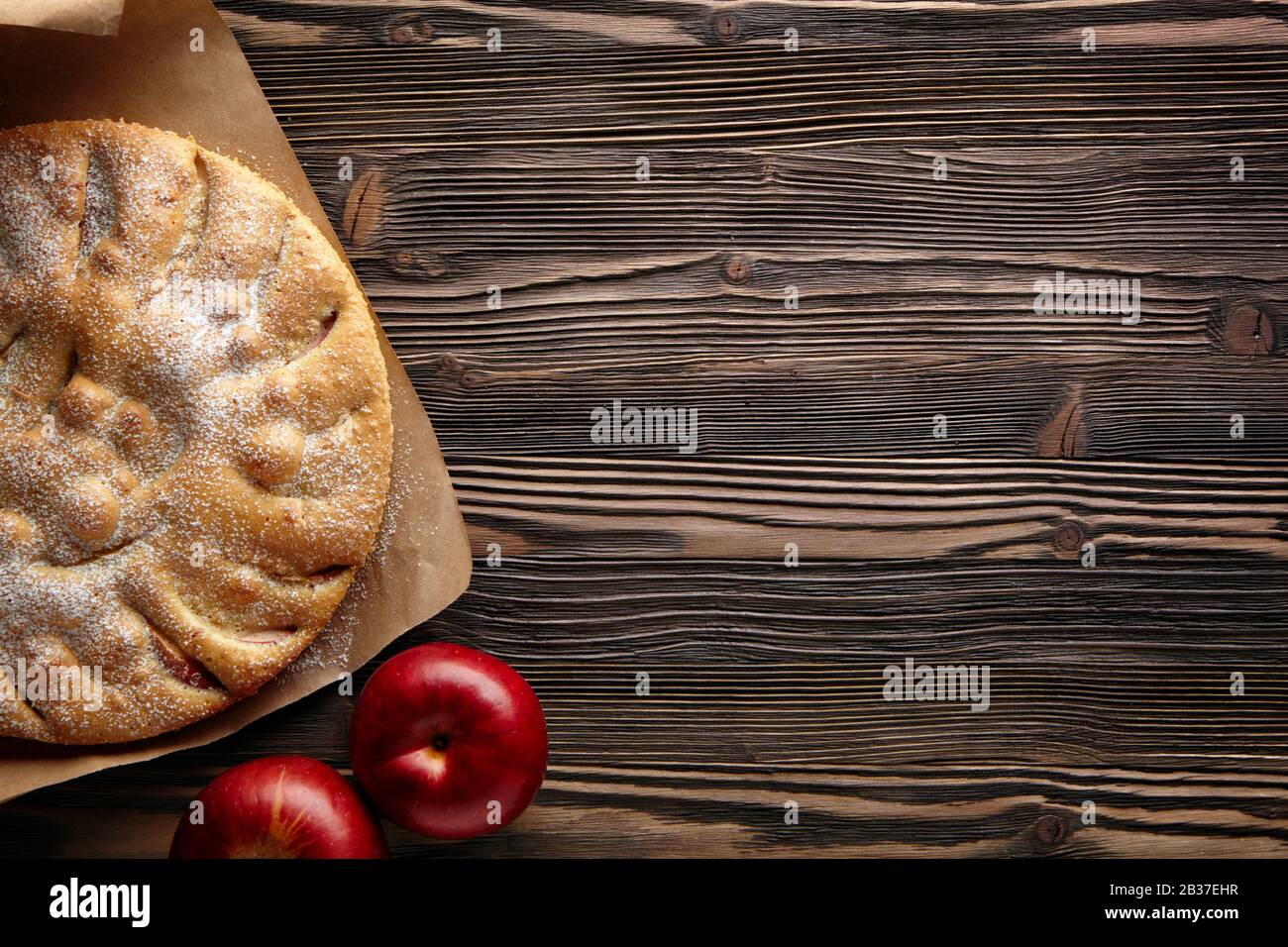 Apple pie on a wooden rustic table. Top view  and empty space for text. Stock Photo