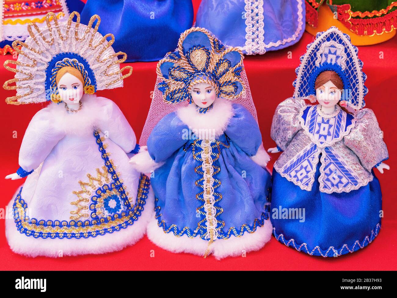 Traditional Russian dolls in winter clothes with a headdress kokoshnik