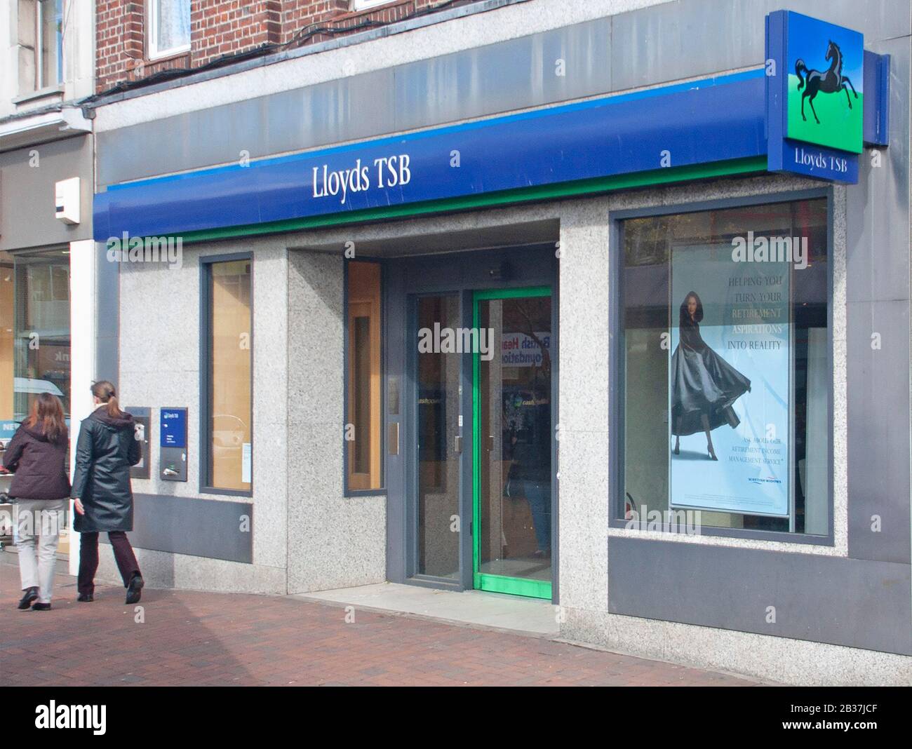 Archive historical Lloyds TSB blue bank sign & entrance shop front window advertising display Scottish Widows  retirement income Brentwood Essex UK Stock Photo