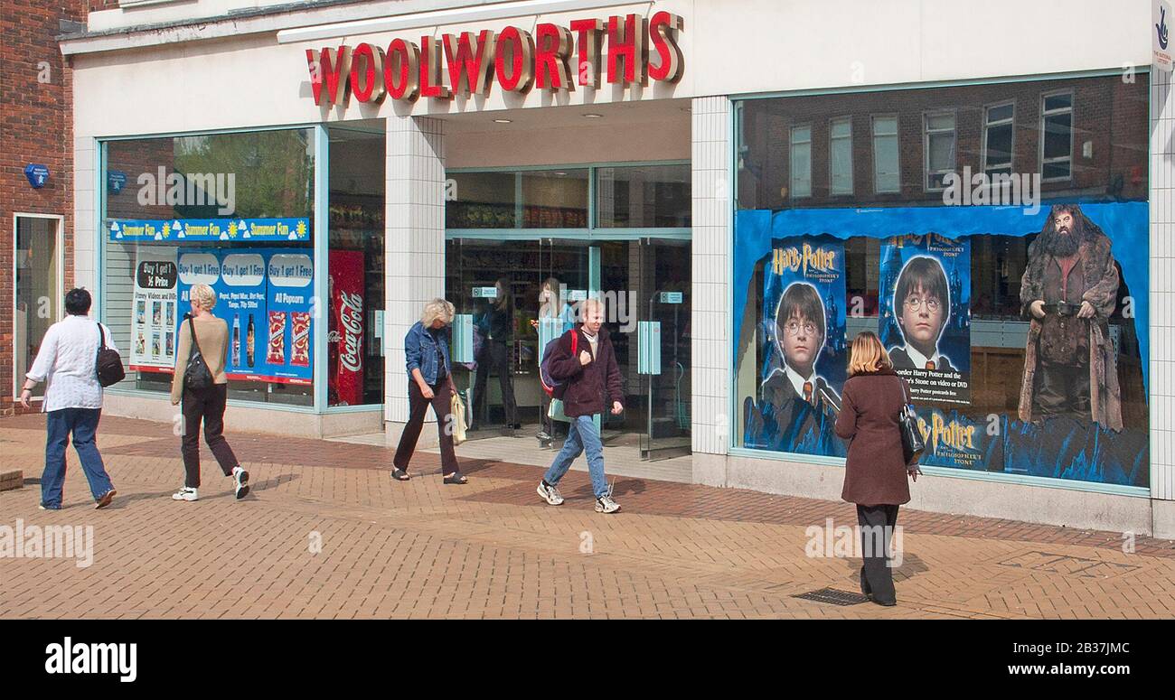 Archival Woolworths Group high street retail store chain business shop front Harry Potter  window adverts & shoppers in Chelmsford Essex England UK Stock Photo