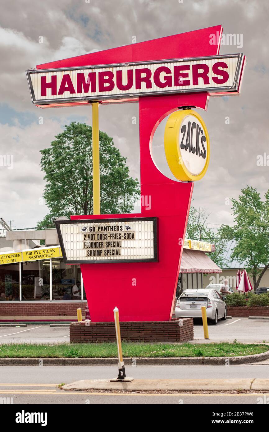 Charlotte, NC/USA - April 26, 2019: Vertical shot of 'Zacks Hamburgers' 1950's style freestanding sign showing Zack's brand and some advertising. Stock Photo