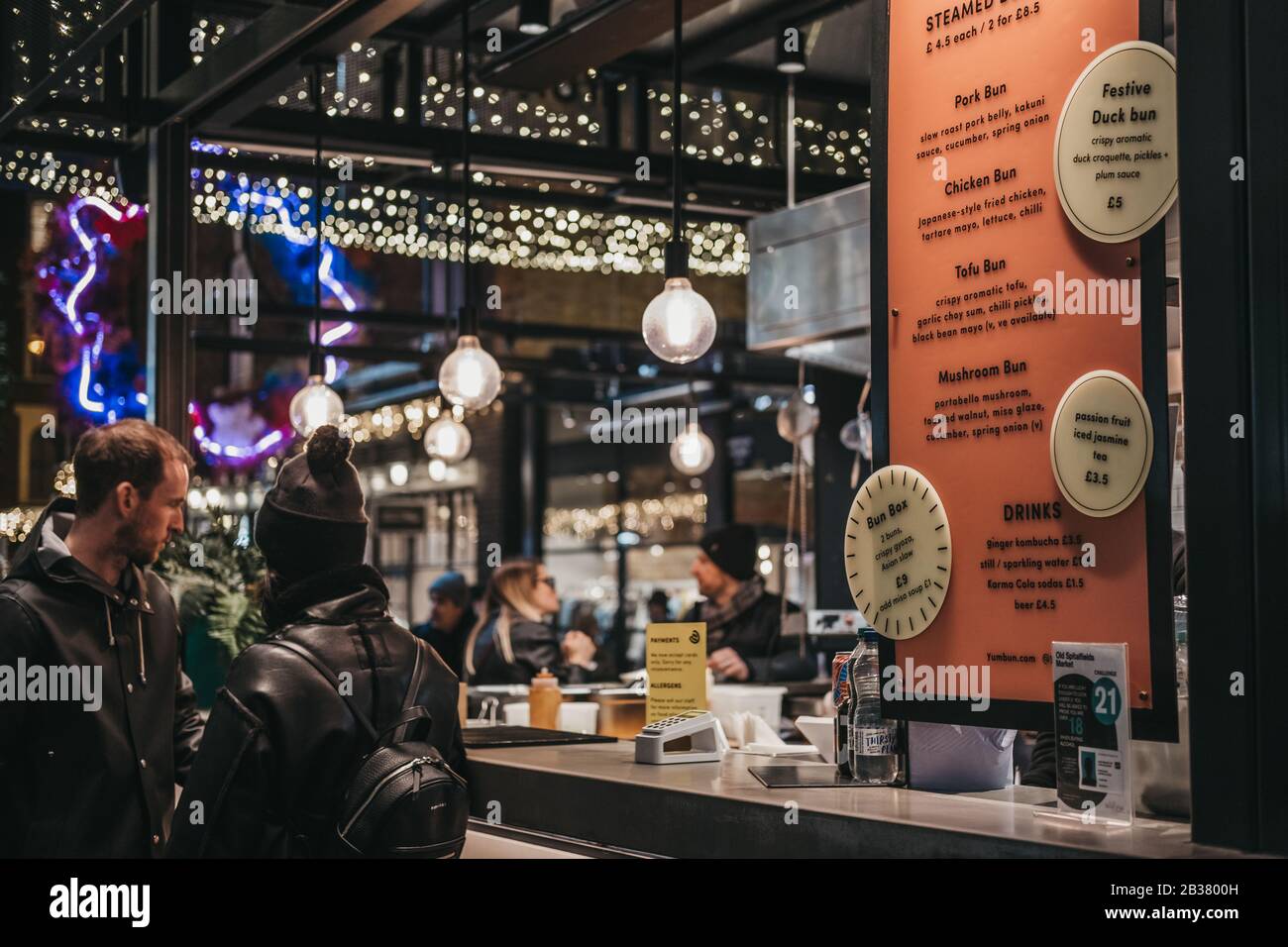 London, UK - December 14, 2019: Menu at a Chinese food stall in Spitalfields Market, one of the finest Victorian Markets in London with stalls offerin Stock Photo