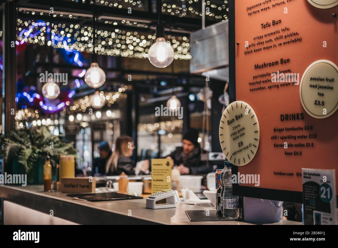 London, UK - December 14, 2019: Menu at a Chinese food stall in Spitalfields Market, one of the finest Victorian Markets in London with stalls offerin Stock Photo