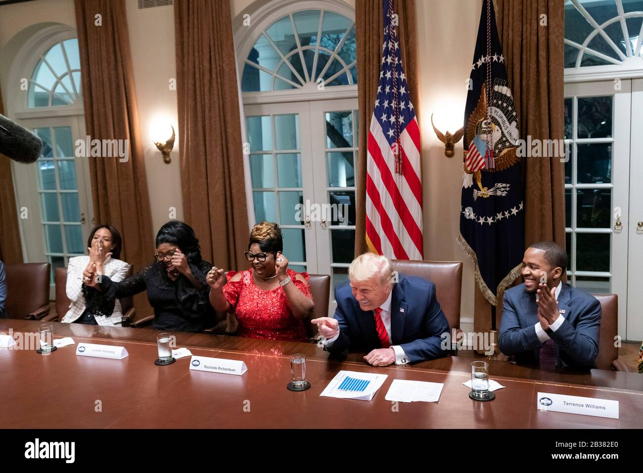 U.S President Donald Trump smiles during a Black History Month event with African American Leaders and Pastor Paula White in the Cabinet Room of the White House February 27, 2020 in Washington, DC. Stock Photo