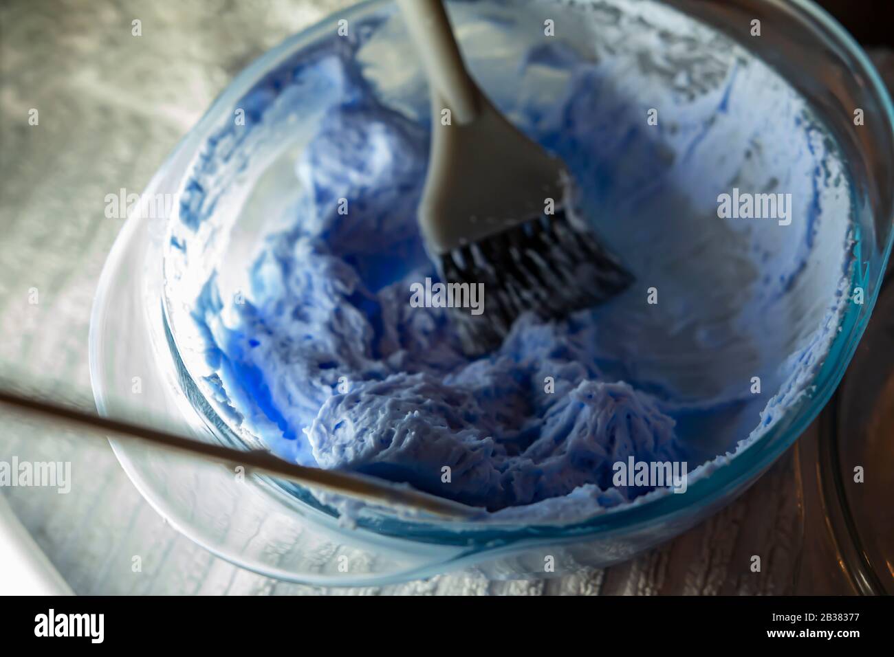 Hair dye product. Bleach for hair. Bowl with peroxide and brush