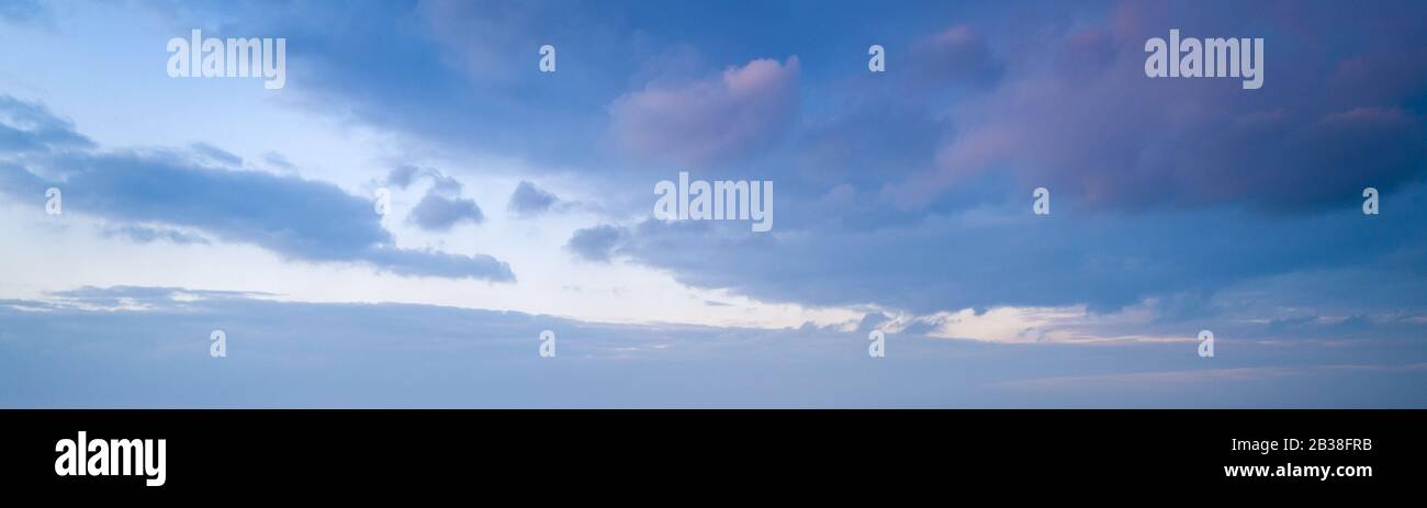 Large panorama of evening sunset sky with beautiful clouds Stock Photo ...