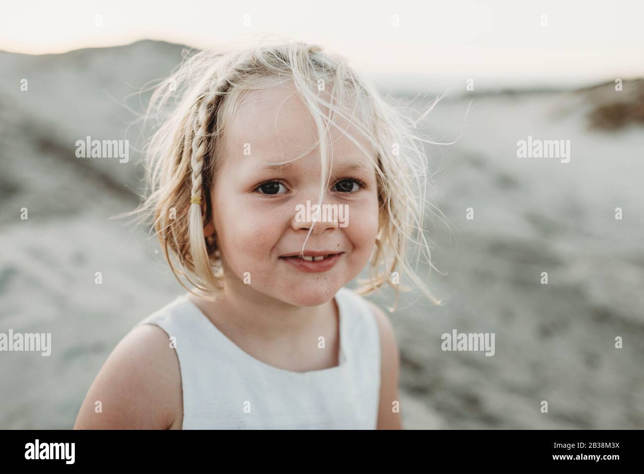 Portrait of preschool-aged girl smiling at beach Stock Photo - Alamy
