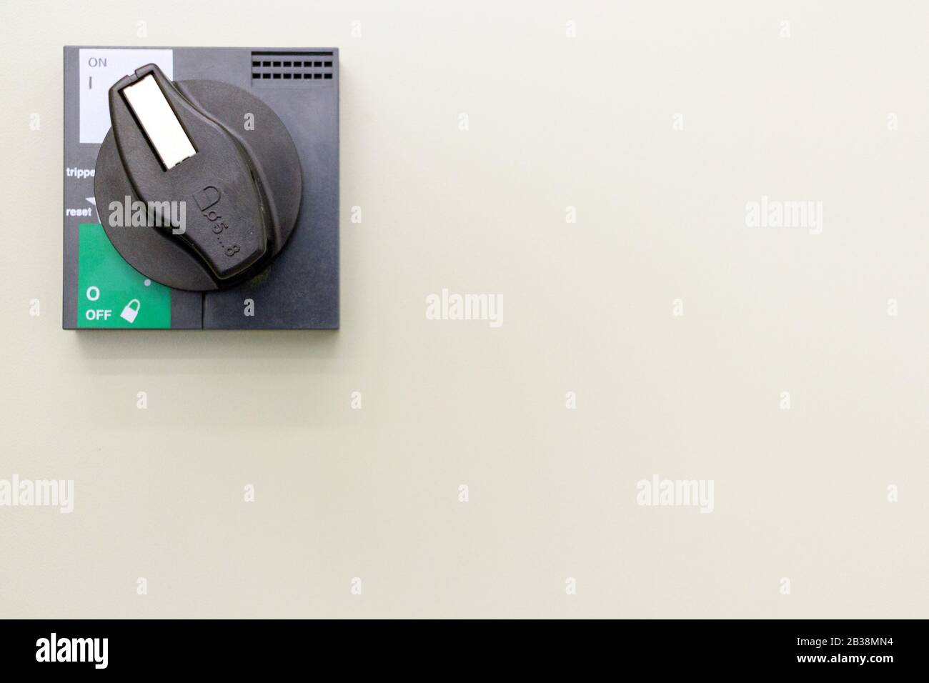 Toggle switch on the white wall. Operation ON-OFF switch Stock Photo