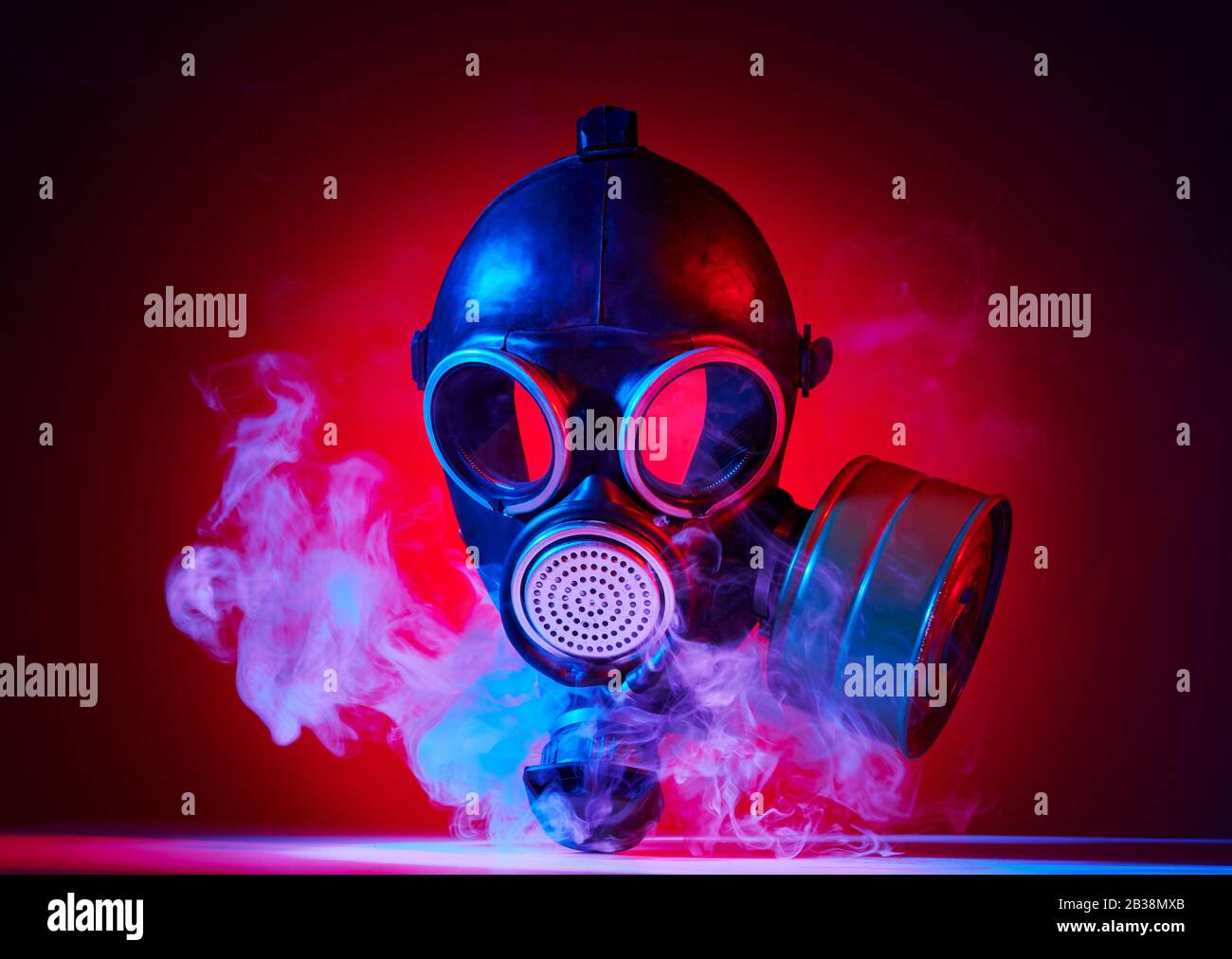 Vintage gas mask with red and blue lights with smoke for war concept Stock  Photo - Alamy