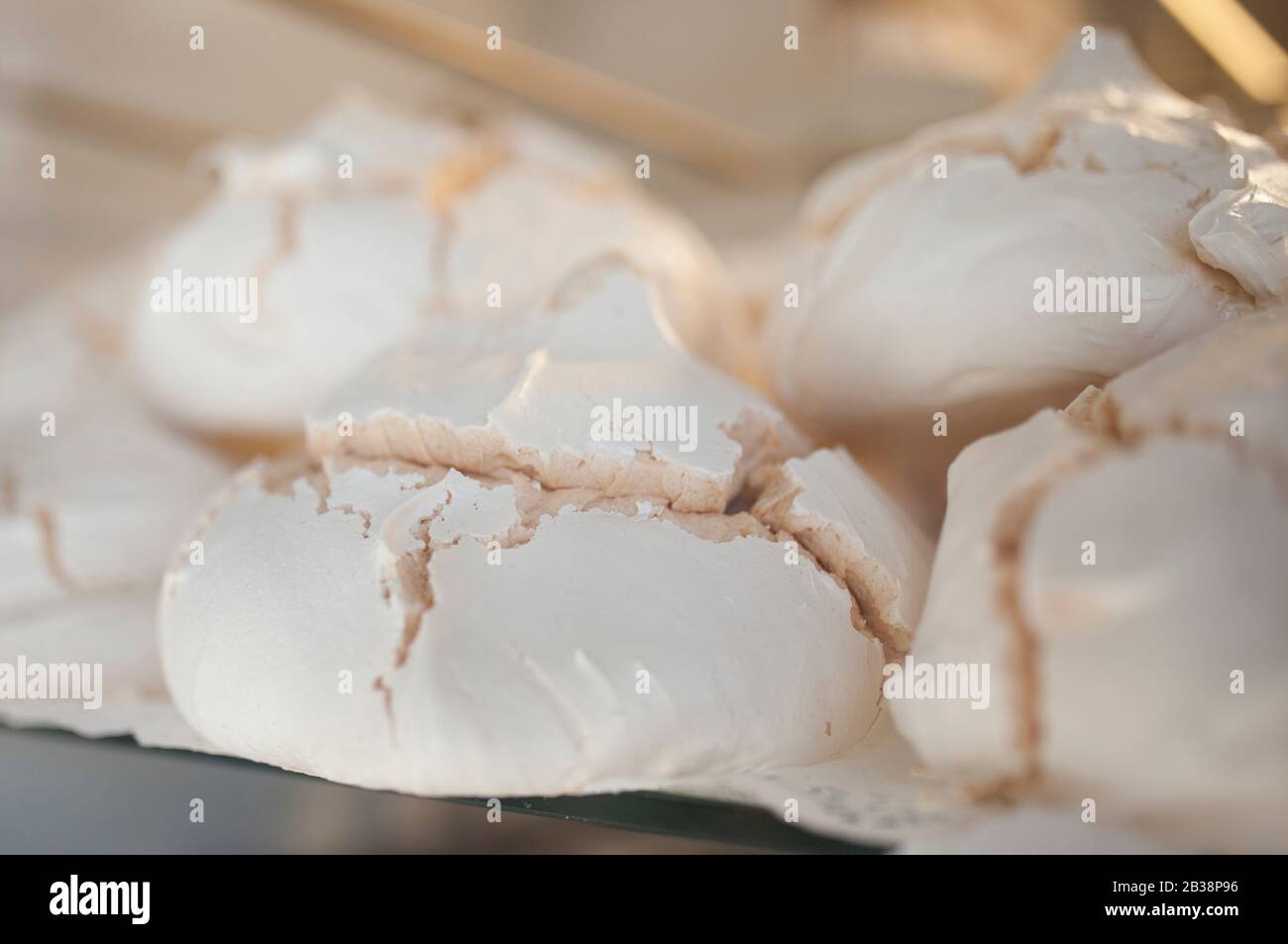 Portuguese suspiros pastries displayed on shop. Traditional dessert