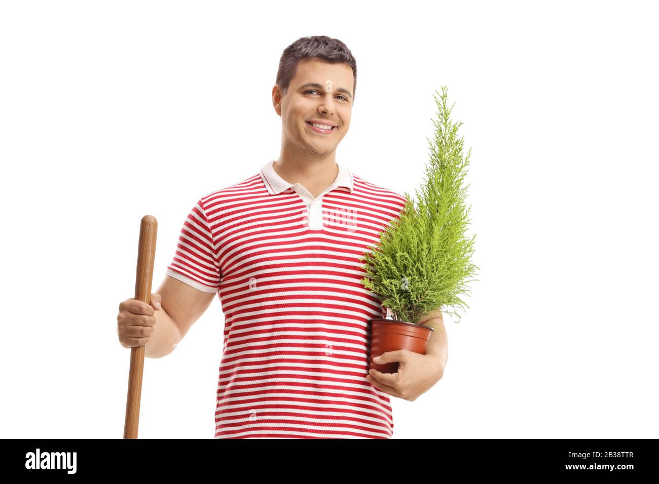 Guy with a shovel and a plant isolated on white background Stock Photo