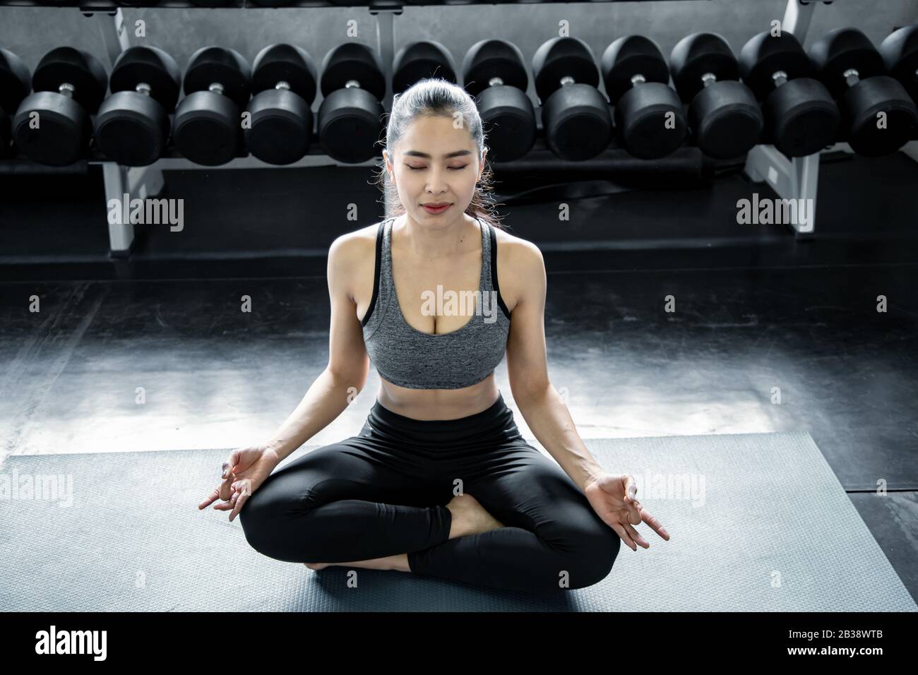 Sexy asian woman playing yoga in the gym. Concept of exercise in gym. Woman workout yoga on mat Stock Photo - Alamy Sexy asian woman playing yoga in the gym. Concept of exercise in gym. Woman workout yoga on mat Stock Photo - Alamy