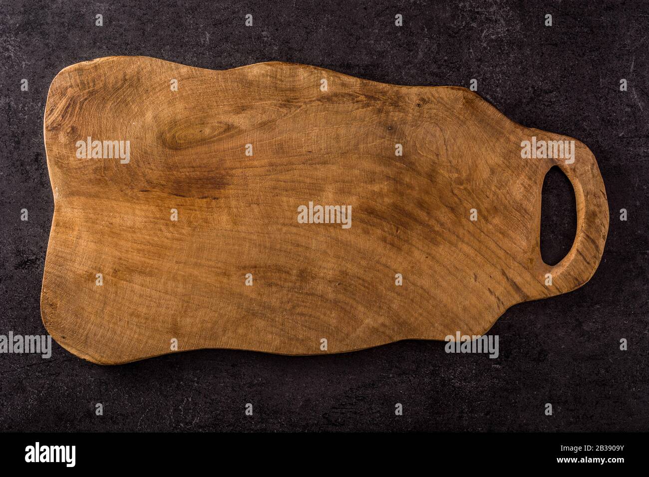 Empty cutting board on black background. Top view Stock Photo