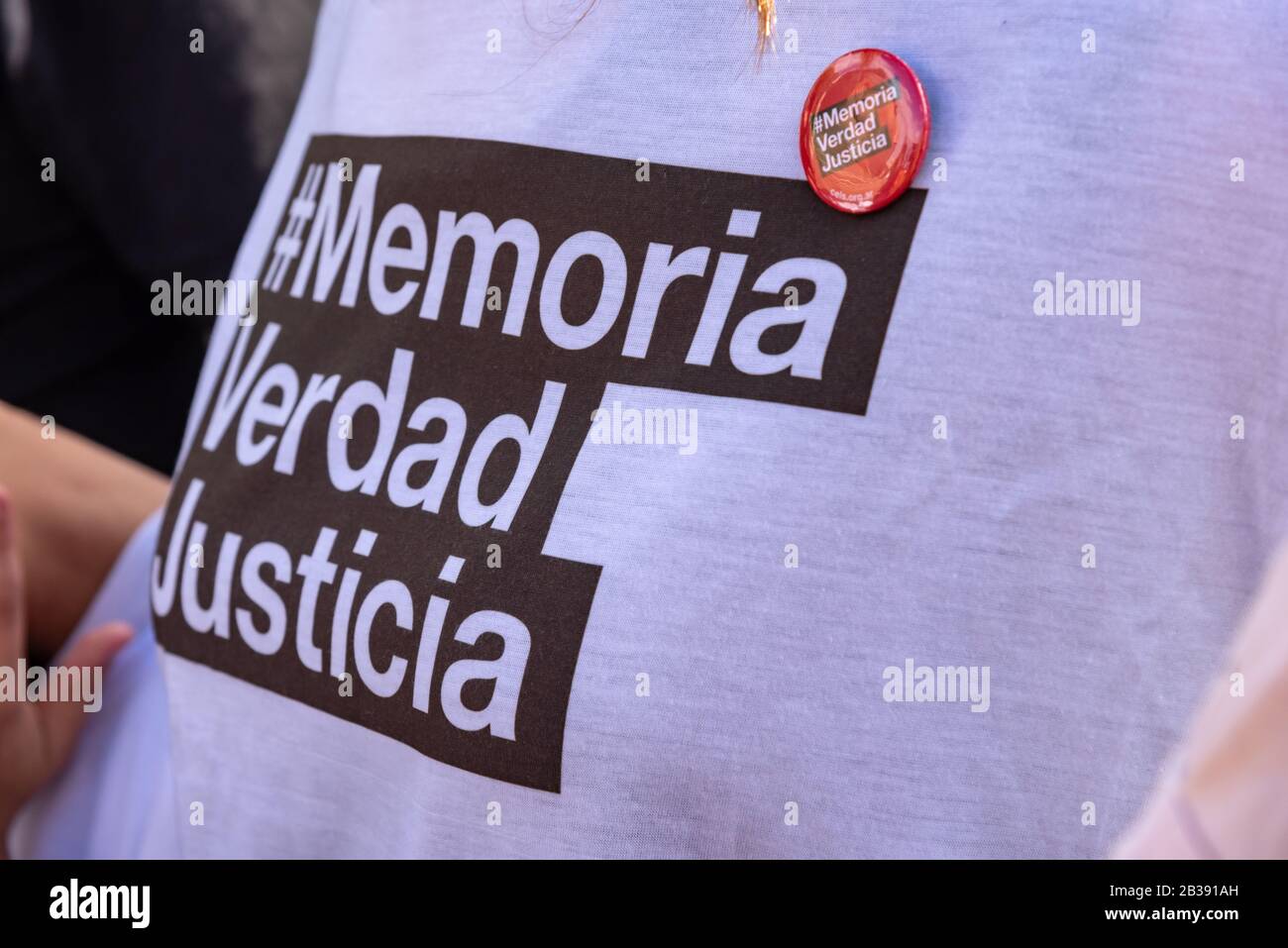 Buenos Aires, Argentina; March 24, 2019: A t-shirt and a pin with the motto 'Memory, truth and justice' in the popular manifestation for 43 years of t Stock Photo