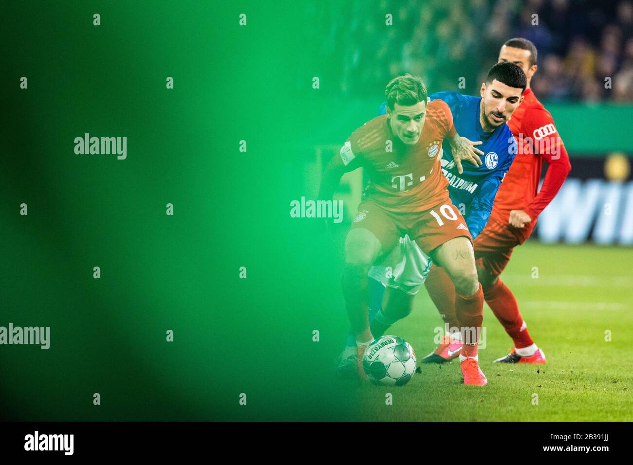 Gelsenkirchen, Germany, Veltins-Arena, 3.03.2020: Philippe Coutinho of Muenchen (in front) against Nassim Boujellab of Schalke 04 during the cup match Stock Photo