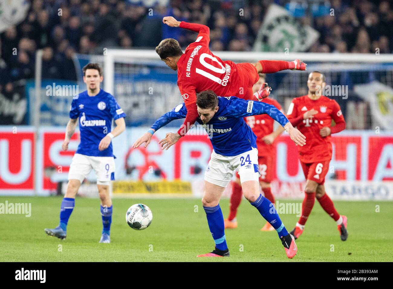 Gelsenkirchen, Germany, Veltins-Arena, 3.03.2020: Bastian Oczipka of Schalke 04 (L) challenges Philippe Coutinho of Muenchen during the cup match DFB Stock Photo