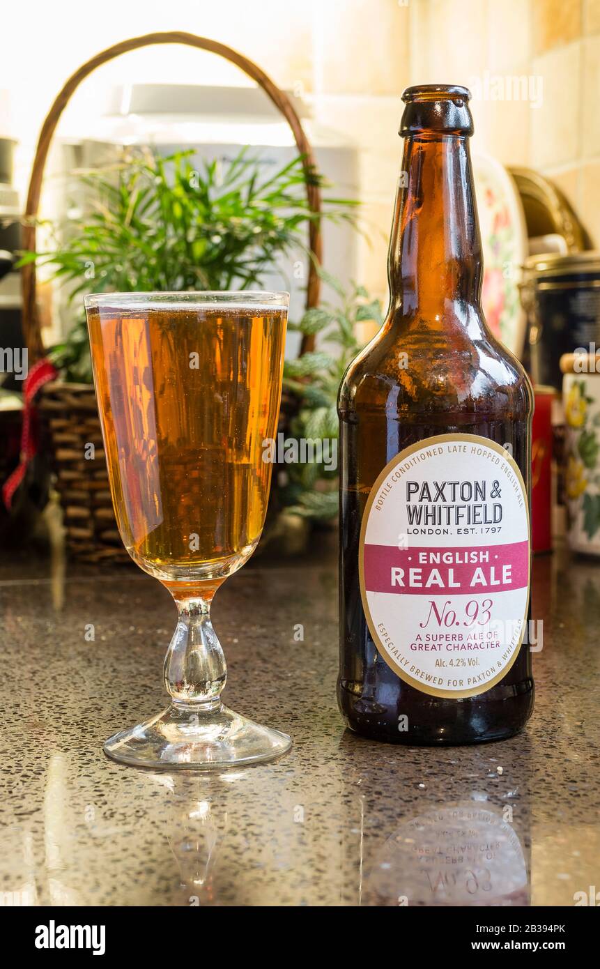 A brown bottle and glass of English real ale brewed for Paxton & Whitfield ready for imbibing Stock Photo