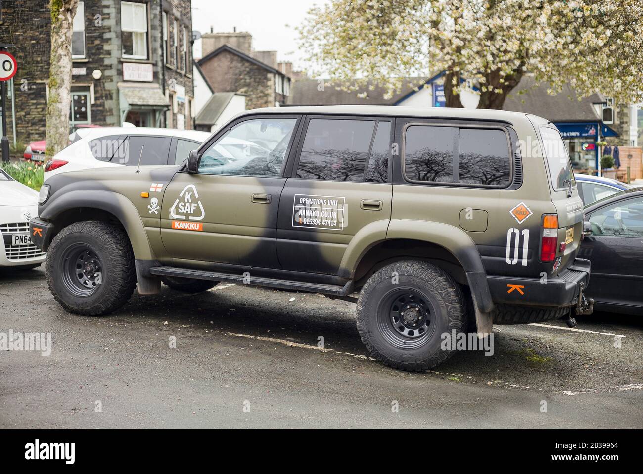 A Land Rover Defender kitted out for use by a tourist company running off-road experiences in Cumbria England UK Stock Photo