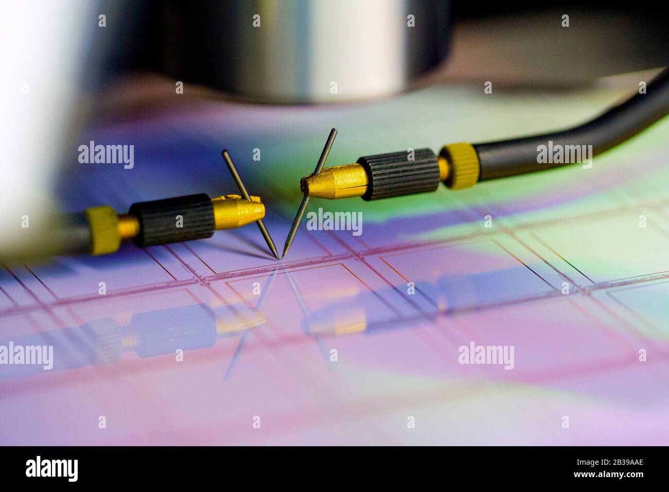 Manual probe system with needles for test of semiconductor on silicon wafer. Selective focus