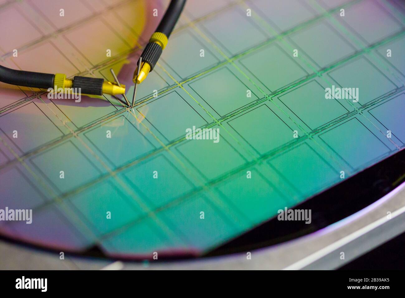 Manual probe system with needles for test of semiconductor on silicon wafer. Selective focus