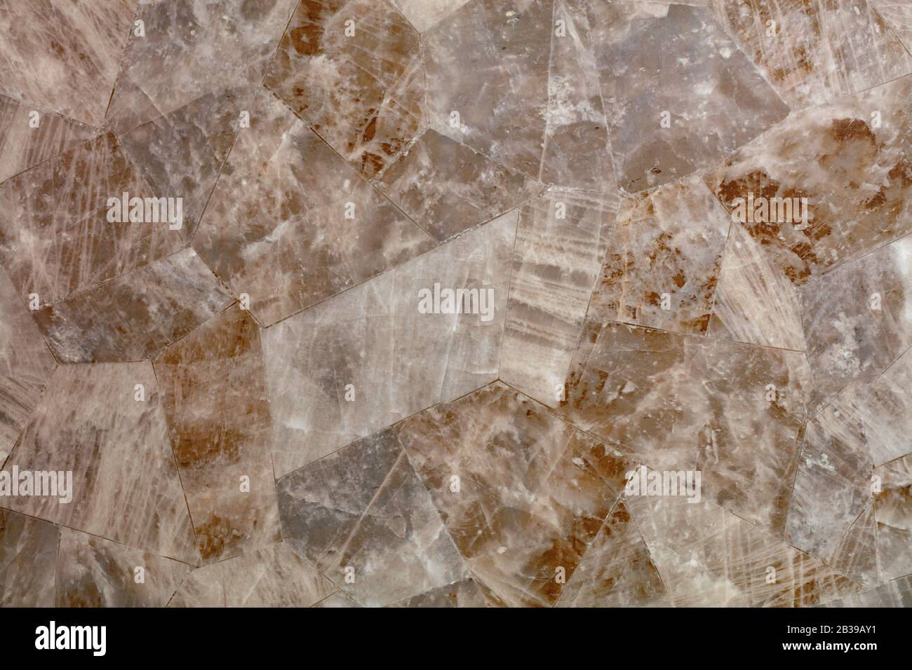 Brown marble tiles with stripes and cracks are selected in shape and