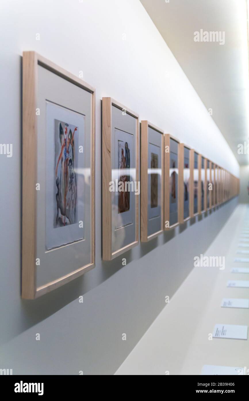 frames with unreadable pictures on brick white wall Stock Photo