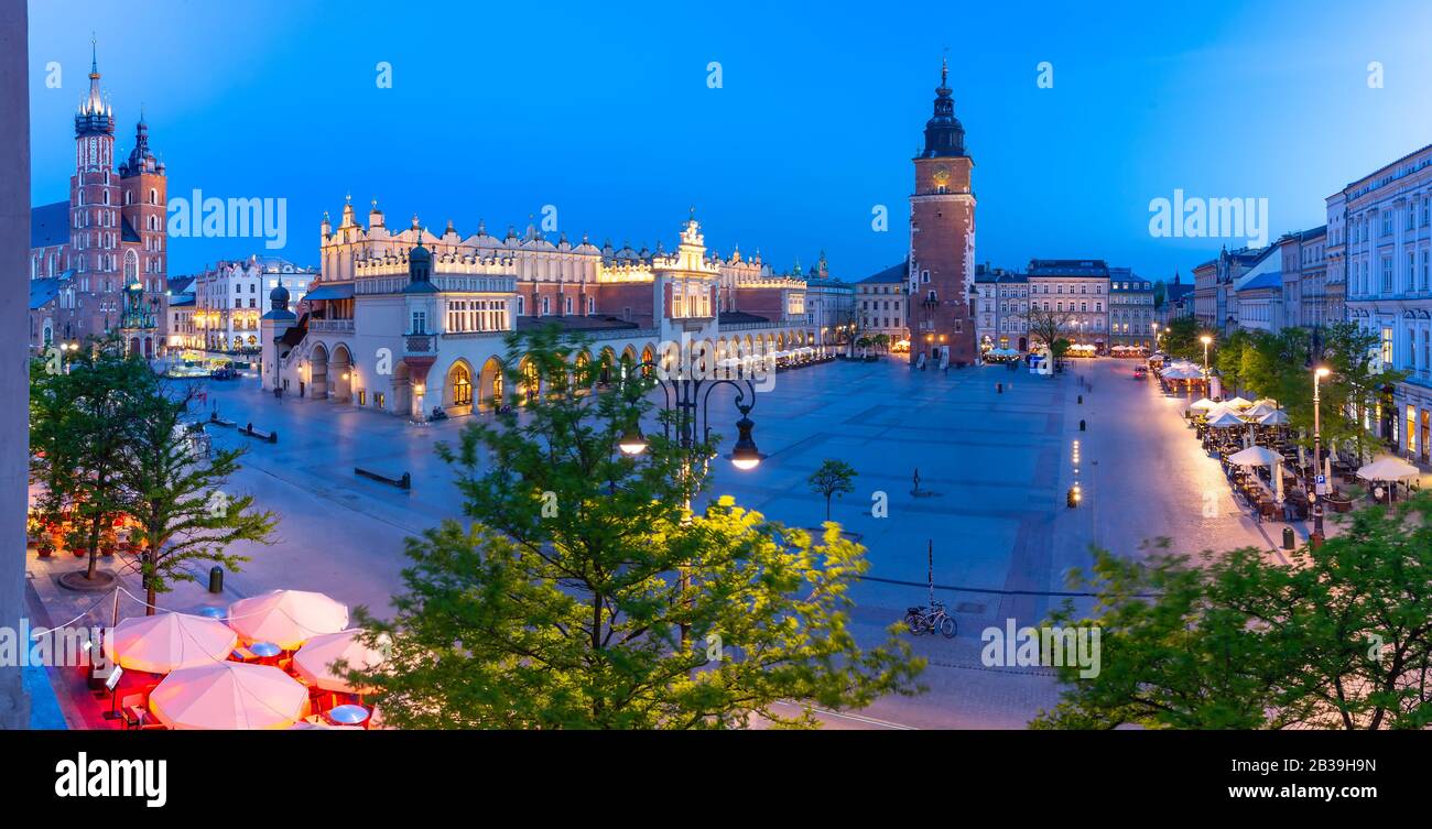 Aerial panorama of Medieval Main market square with Cloth Hall and Town Hall Tower in Old Town of Krakow at night, Poland Stock Photo