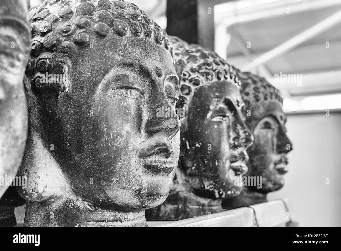 Closeup cement Buddha head. Modern Art concept. Black and white