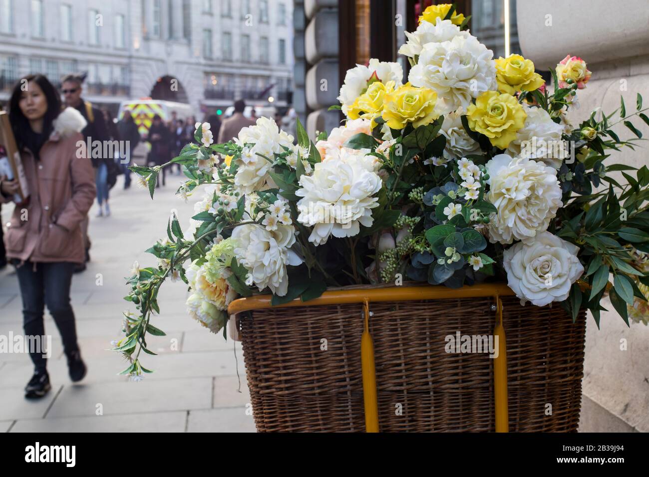 London, UK 13 February, 2020 A variety of flowers in a wicker basket
