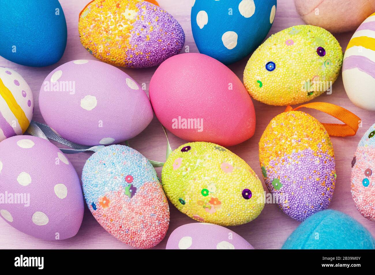 Easter eggs decorated in various colors. Festive background Stock Photo