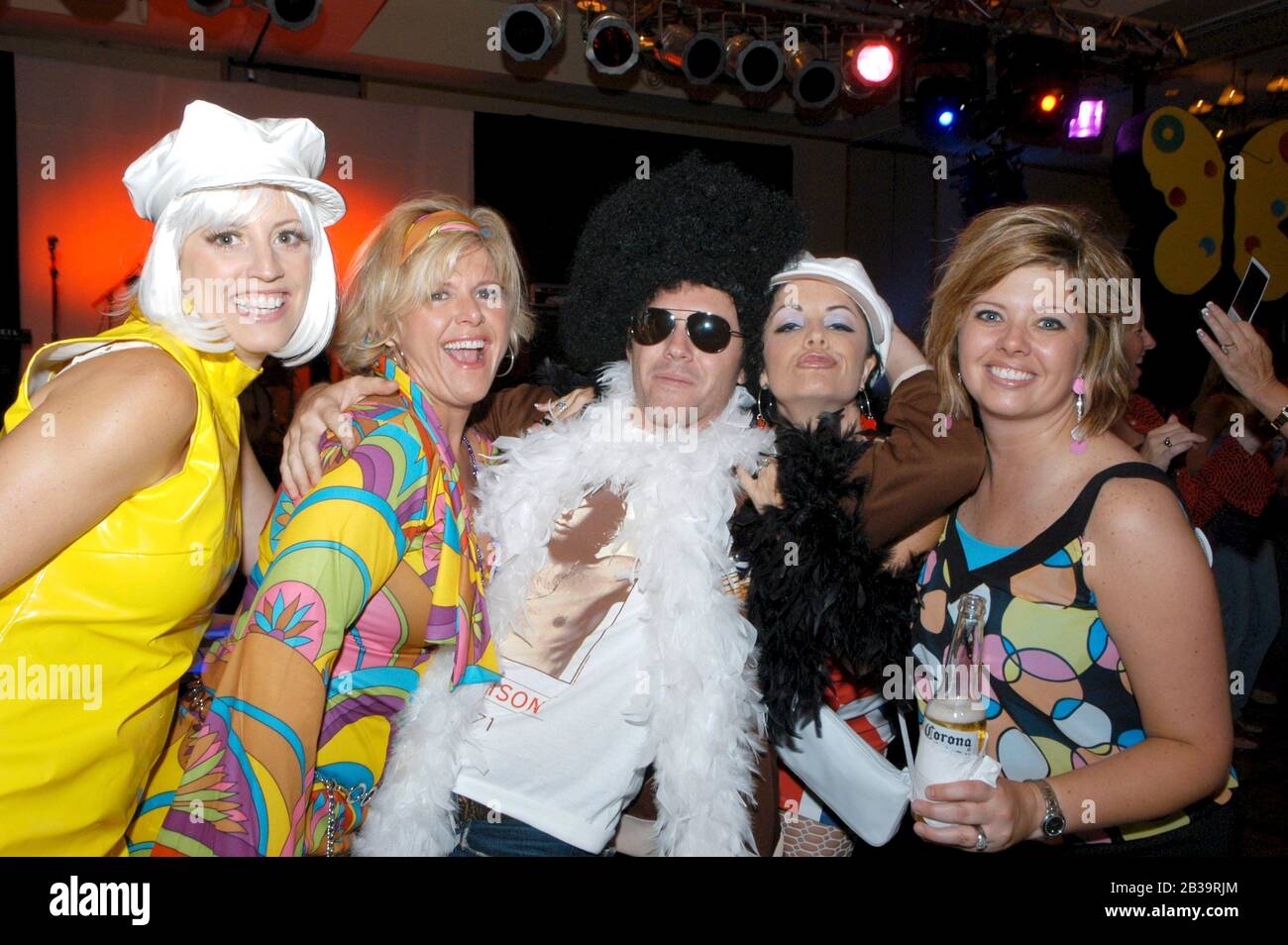 San Antonio, TX  May, 2004: Trade association convention attendees dress up in costumes for 1960s-themed reception. ©Bob Daemmrich Stock Photo