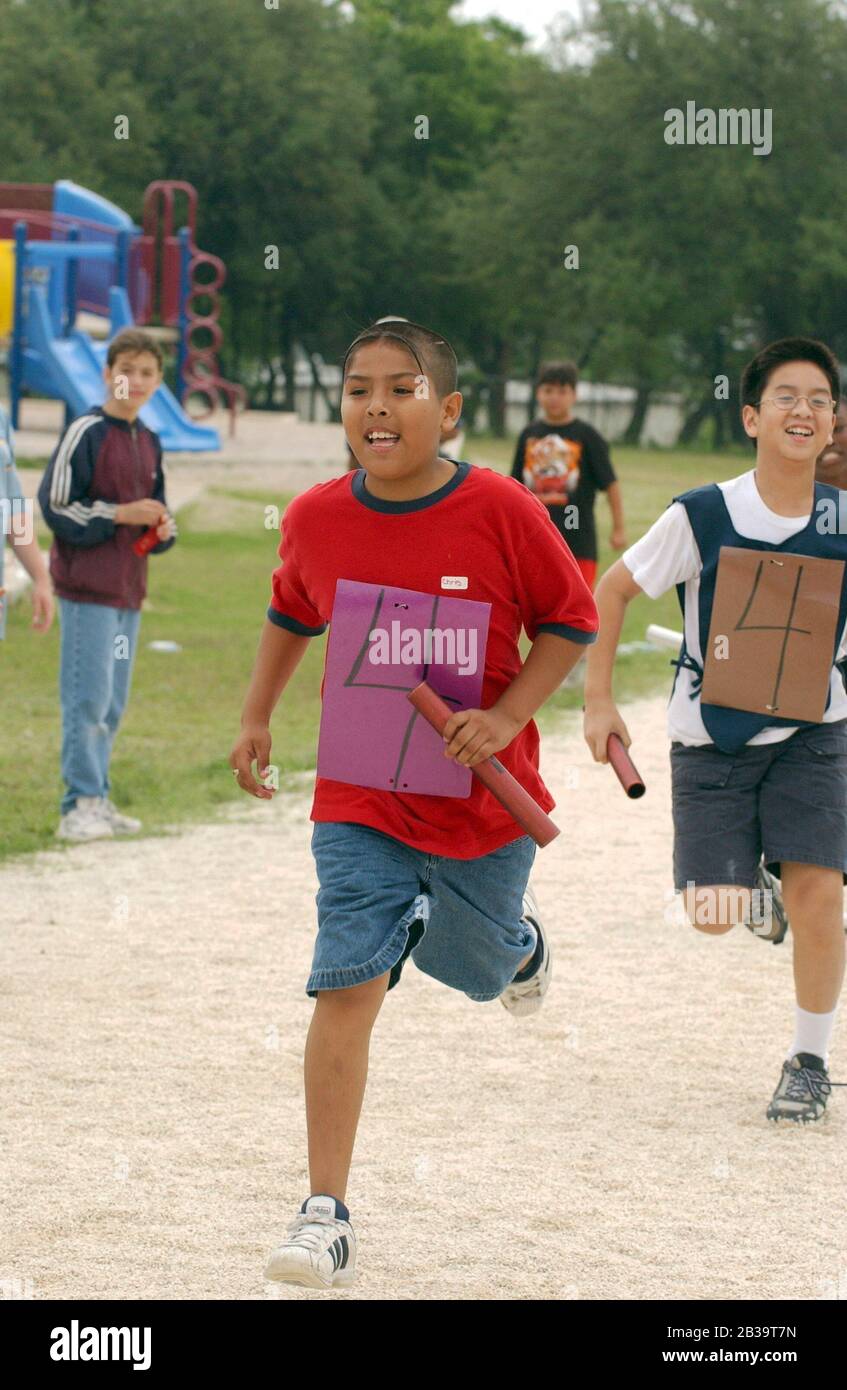 Austin Texas USA, circa 2004 Fourthgrade boys compete in relay run