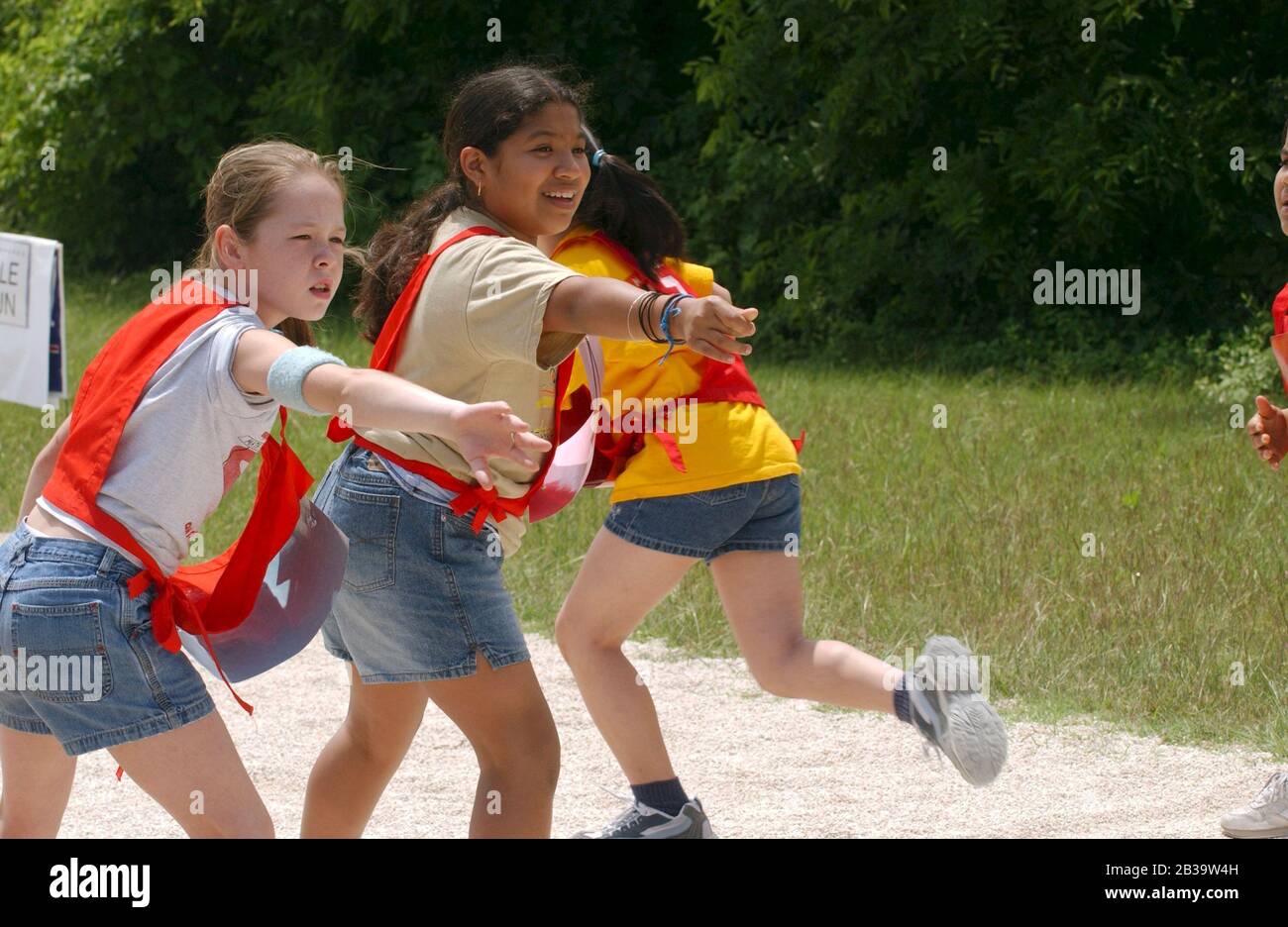 Austin Texas USA, circa 2004 Fourth grade relay team members wait for