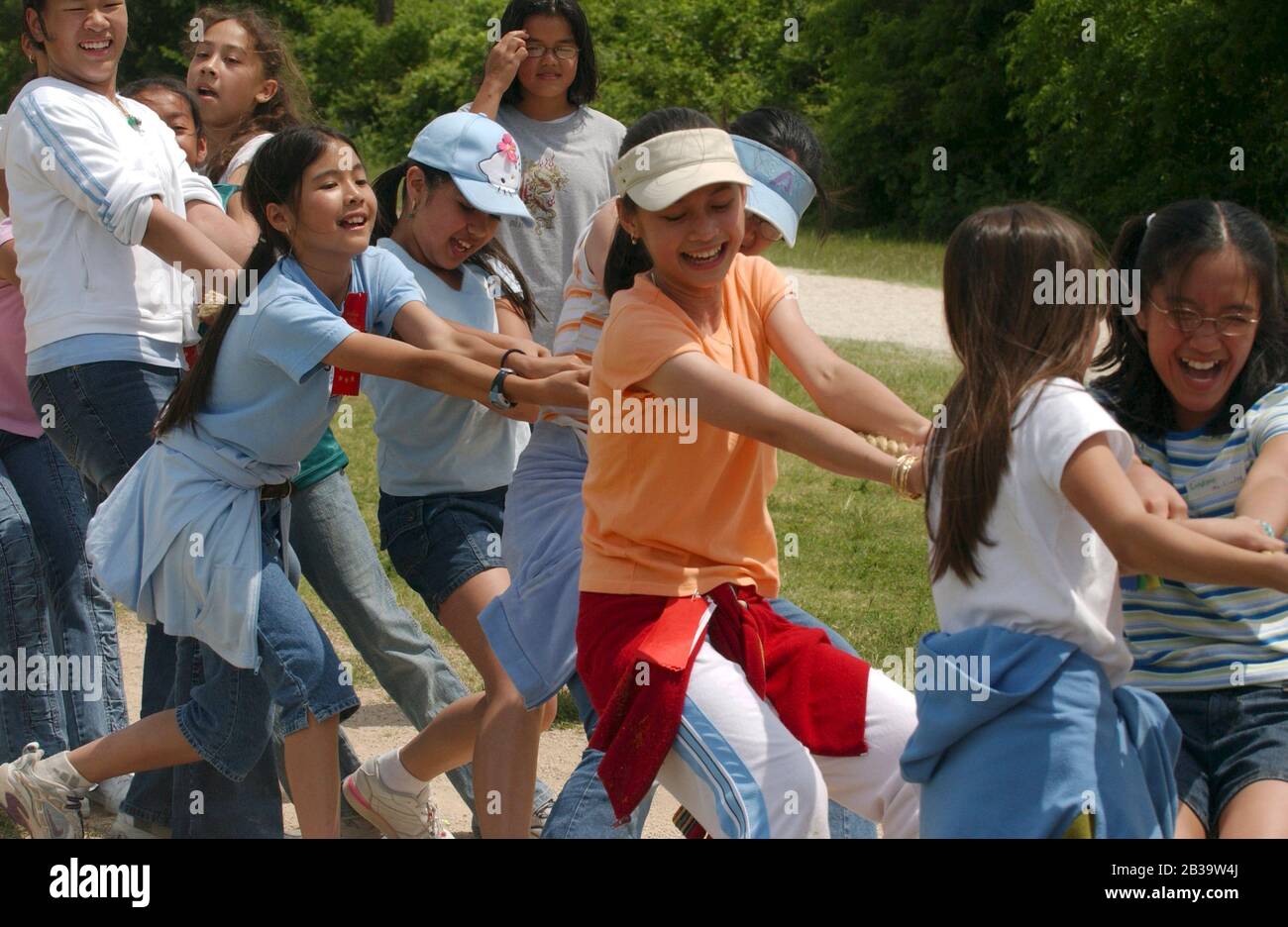 Austin Texas USA, circa 2004: Sixth-grade girls compete in a tug of war during annual Track and Field day at Walnut Creek Elementary School.   ©Bob Daemmrich Stock Photo
