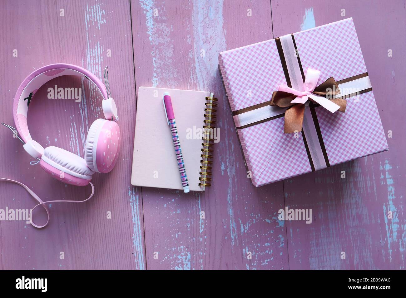 pink color gift box and notepad on table Stock Photo