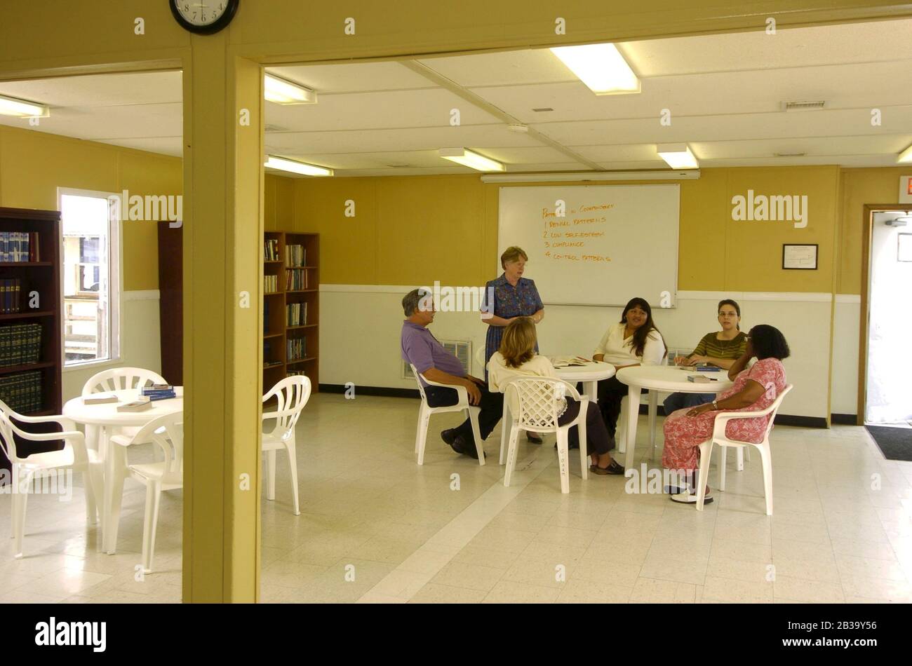 Del Valle, Texas  USA, Oct. 25 2004: Residents meet for a counseling session in the community room of the Austin Transition Center, a halfway house for parolees making the transition from prison to the free world.  (persons in photograph are models). ©Bob Daemmrich Stock Photo