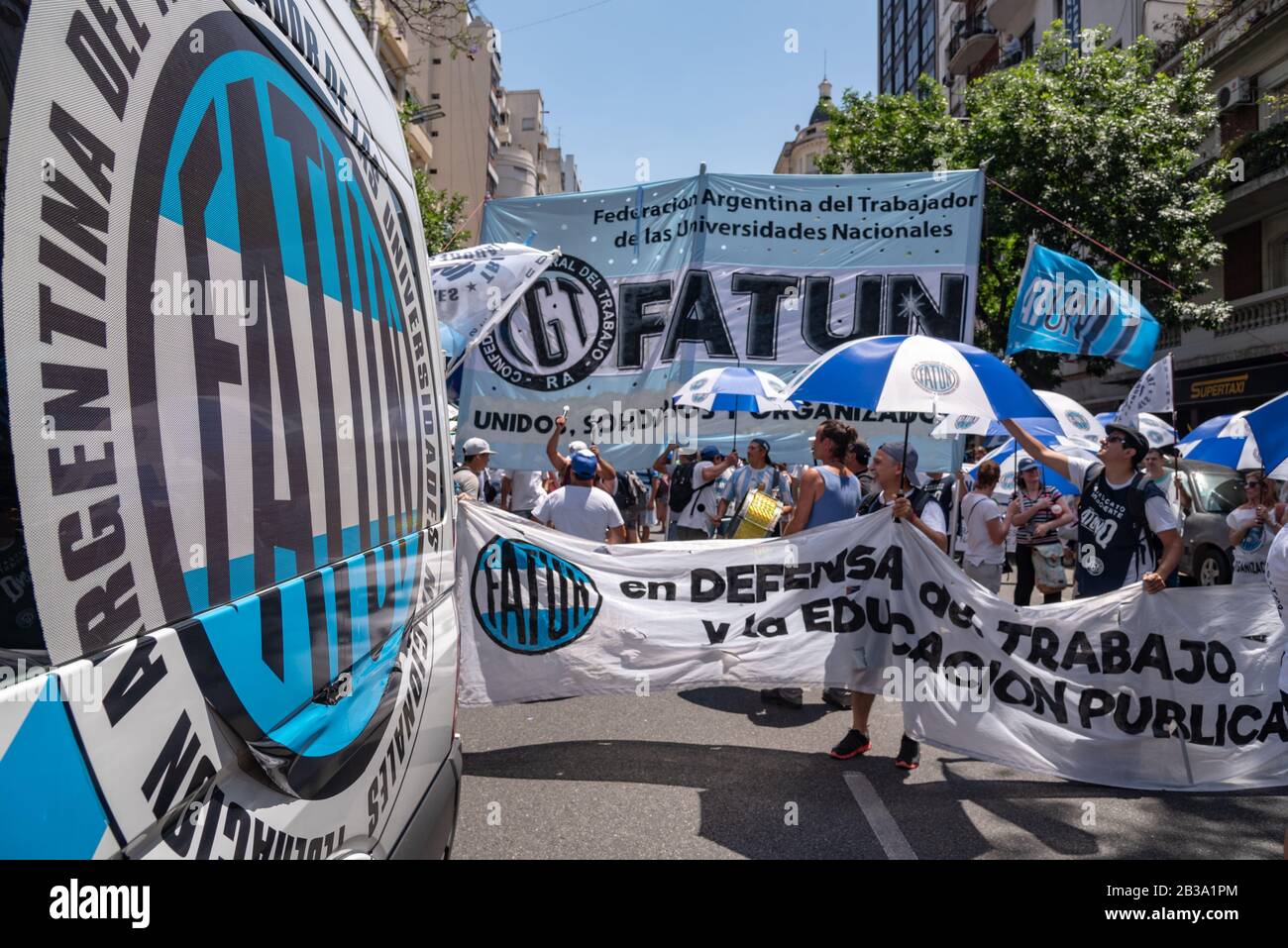 Buenos Aires, Argentina; December 10, 2019: The front of a column of the Argentine Federation of the Worker of the Argentine National Universities mob Stock Photo