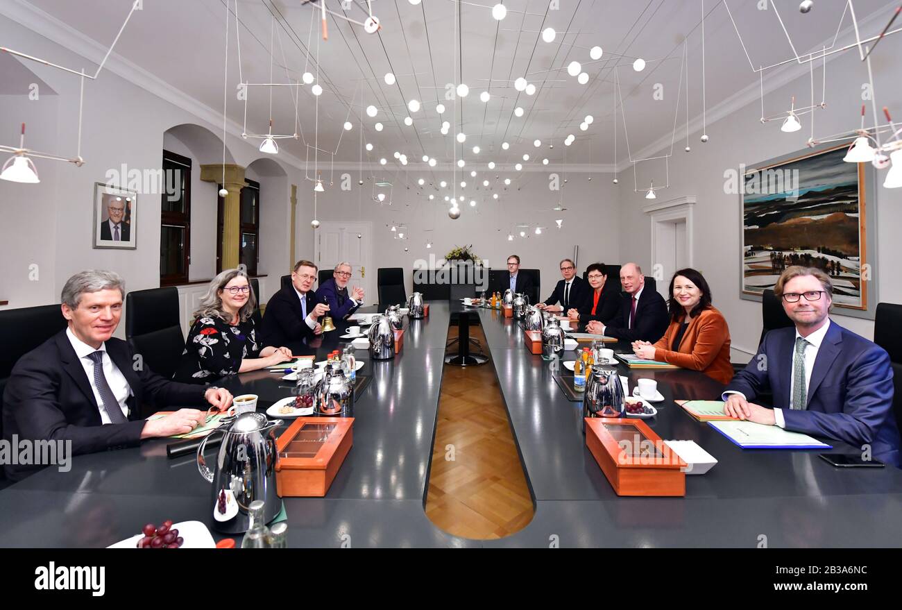 Erfurt, Germany. 04th Mar, 2020. Bodo Ramelow (Die Linke, 3rd from left), Minister President of Thuringia, and the ministers are sitting at the cabinet table at their first meeting. Ramelow had been elected in the Landtag on the same day. After his swearing-in, he appointed the ministers of his minority government from the Left Party, SPD and Greens. Credit: Martin Schutt/dpa-Zentralbild/dpa/Alamy Live News Stock Photo