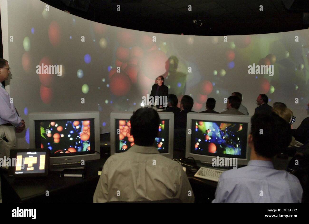 Austin, Texas 19 OCT 2000:  Visitors to the University of Texas at Austin Visual Research Laboratory (VRL) at the Applied Computational Engineering and Sciences Building (ACES) watch a simulated mathematical model of an exploding galaxy during the dedication of the building Thursday. Images are beamed onto a cylindrical screen using 13 projectors and an SGI Onyx2 Supercomputer. ©Bob Daemmrich Stock Photo