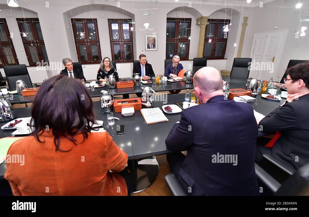 04 March 2020, Thuringia, Erfurt: Bodo Ramelow (Die Linke, M), Minister President of Thuringia, and the ministers are sitting around the cabinet table at their first meeting. Ramelow had been elected in the Landtag on the same day. After his swearing-in, he appointed the ministers of his minority government from the Left Party, SPD and Greens. Photo: Martin Schutt/dpa-Zentralbild/dpa Stock Photo