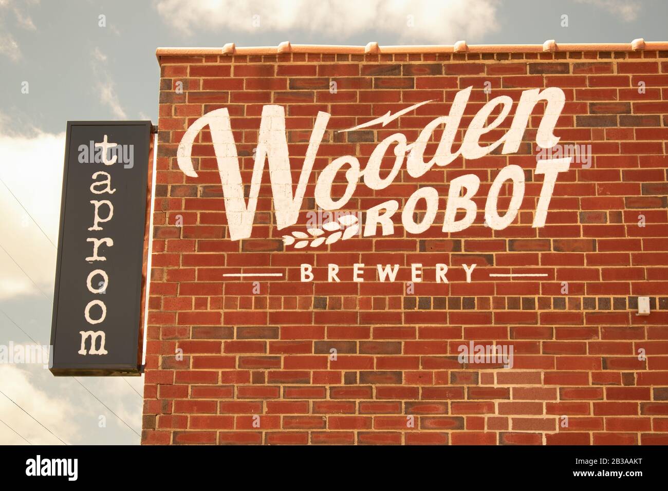 Charlotte, NC/USA - May 14, 2019: Medium closeup of the 'Wooden Robot Brewery' and taproom in South End showing brand/logo and hanging sign. Stock Photo
