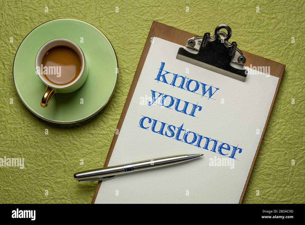 know your customer - handwriting on a clipboard with coffee, business marketing and public relations concept Stock Photo