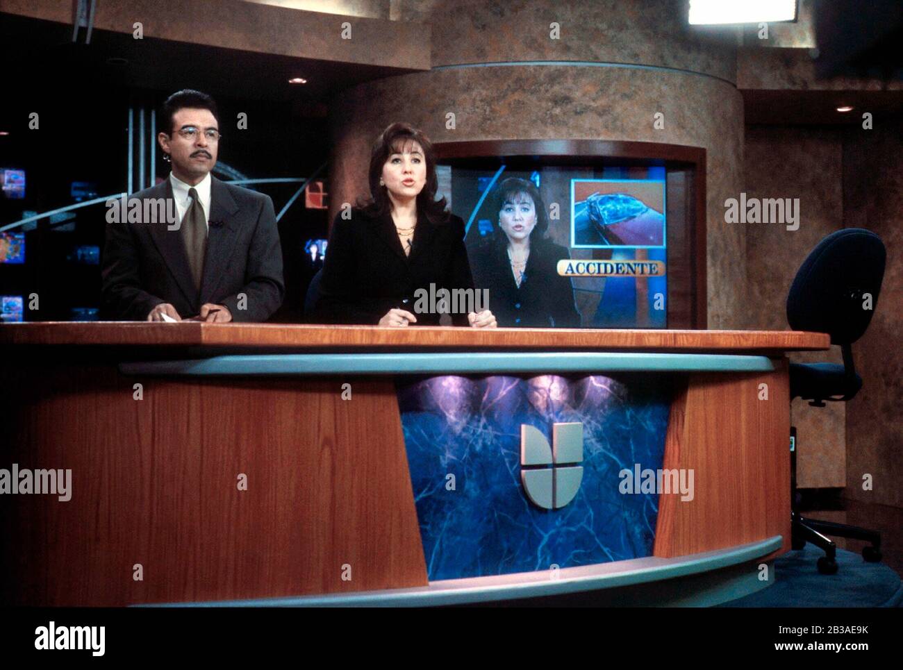 San Antonio, Texas USA, March 1, 2002: Spanish-language station KWEX-TV 41 Univision affiliate in one of the nation's largest Hispanic markets.  Anchors Monica Navarro and Antonio Guillen deliver the 5:00 P.M. newscast.  ©Bob Daemmrich Stock Photo