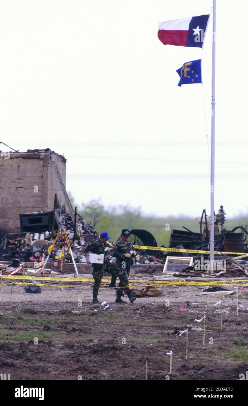 Waco Texas USA, April 1993: Federal agents scour the remains of the Branch Davidian headquarters after a fire killed 80 adults and children holed up there. The fire ended a 51-day siege of the fringe religious group's compound that began with a raid by federal Bureau of Alcohol, Tobacco and Firearms looking for illegal weapons. Four ATF agents and six Branch Davidians died in the raid, which led to the ensuing standoff that garnered international attention. ©Bob Daemmrich Stock Photo