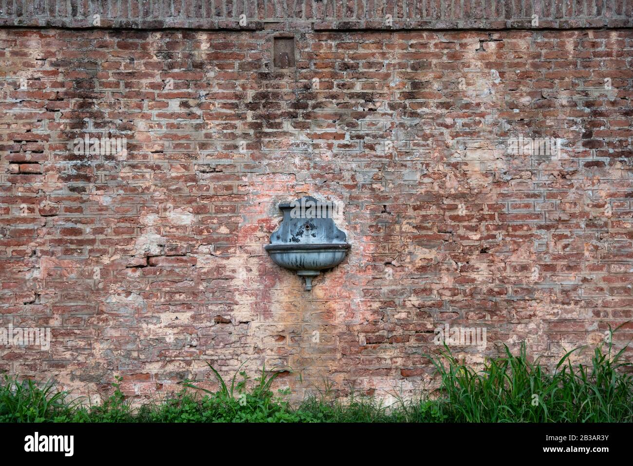 Antique drinking fountain - sprue - spout on a train station Stock Photo