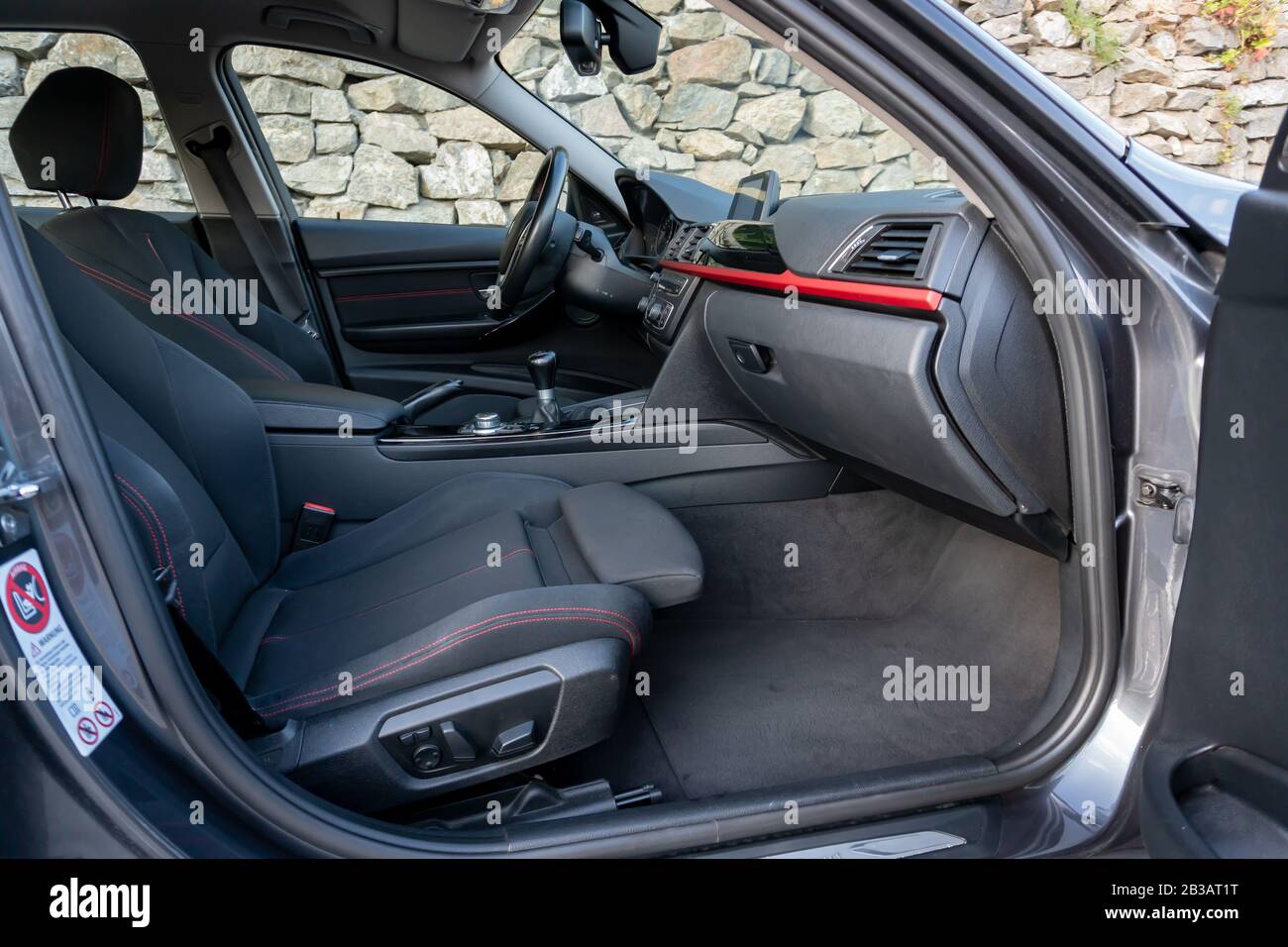 Cluj-Napoca, Cluj,Romania-07.28.2019-Sporty interior with red accents of a BMW 3 Series,M Performance,sedan,very maintained,year of manufacture 2012 Stock Photo