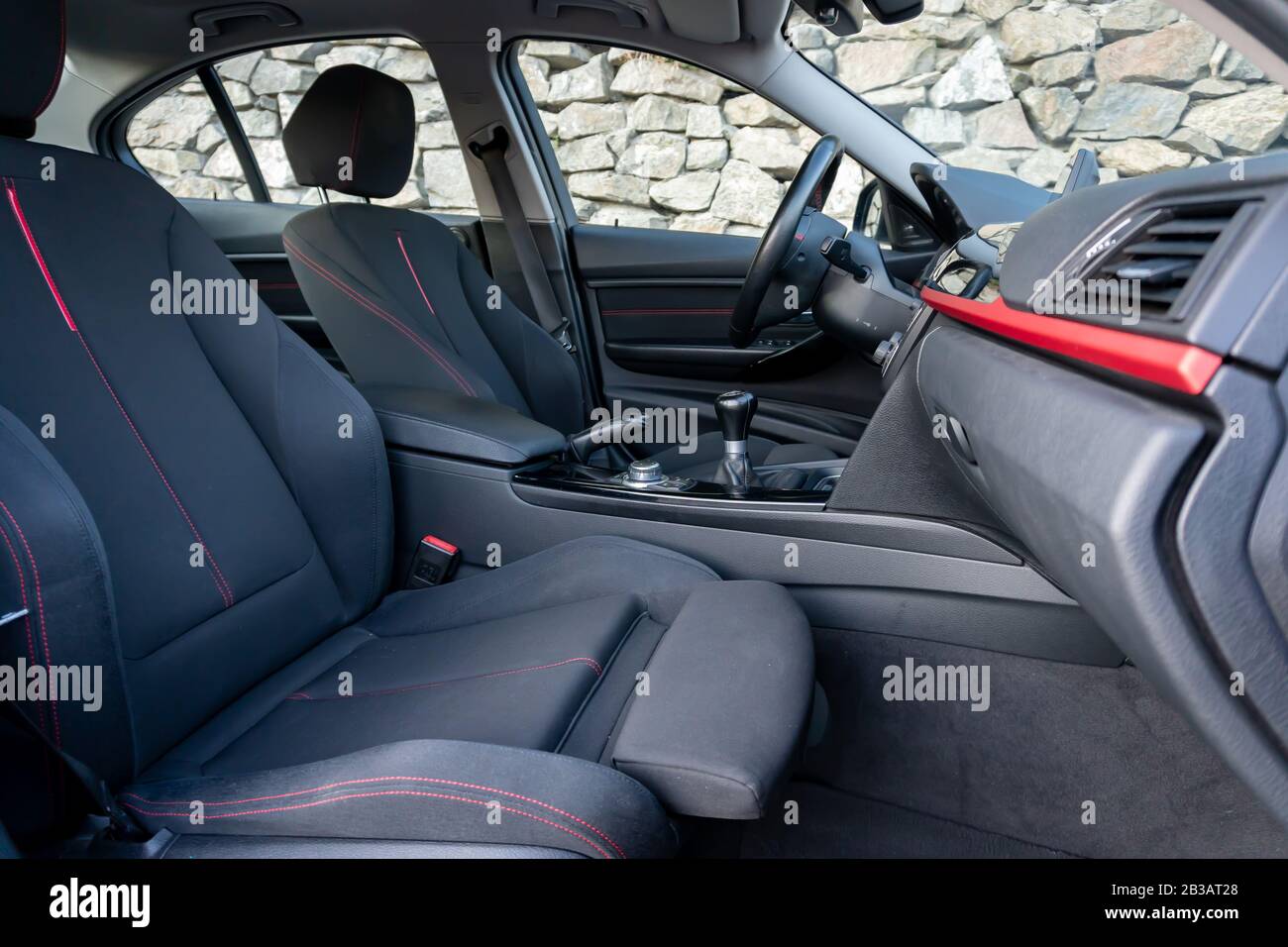 Cluj-Napoca, Cluj,Romania-07.28.2019-Sporty interior with red accents of a BMW 3 Series,M Performance,sedan,very maintained,year of manufacture 2012 Stock Photo