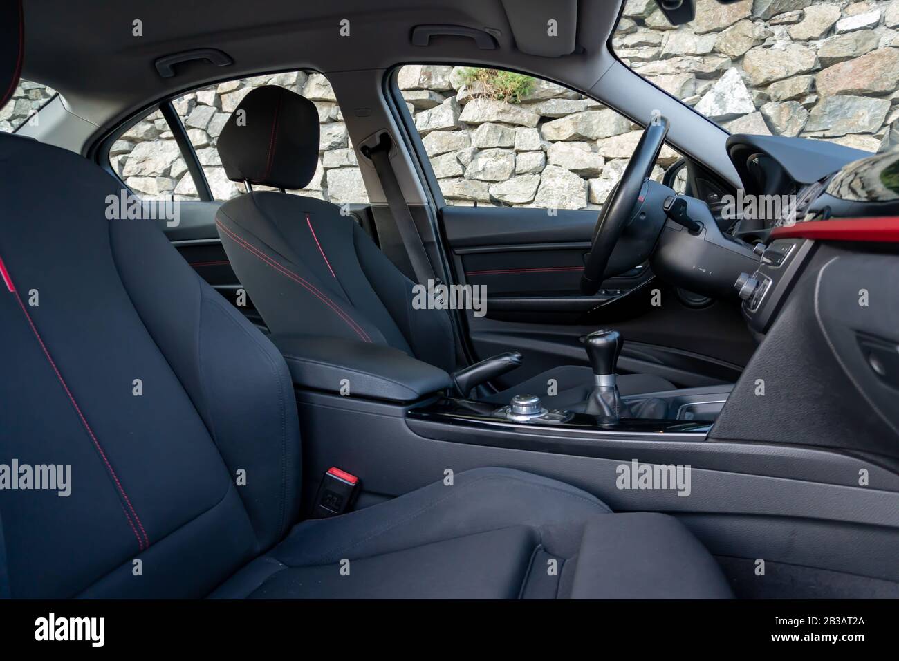 Cluj-Napoca, Cluj,Romania-07.28.2019-Sporty interior with red accents of a BMW 3 Series,M Performance,sedan,very maintained,year of manufacture 2012 Stock Photo